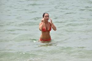 Two sexy ass girls on the beach in bikinis