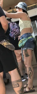 Tatted up hippie in short jean shorts with a nip slip