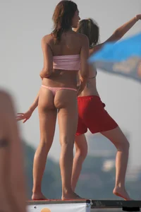 A bunch of sexy beach voyeur babes in bikinis, thongs and topless