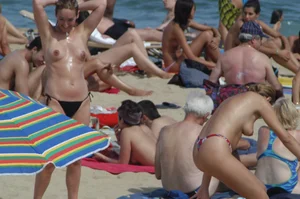 Topless girls on a beach in Barcelona