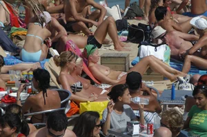 Topless girls on a beach in Barcelona