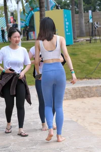 Hula hooping skinny Asian in light blue leggings with vpl