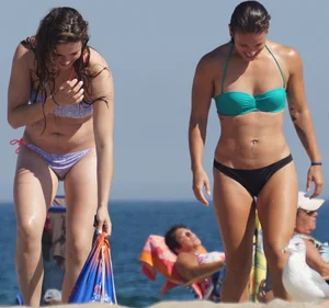 2 cute friends in bikinis on the beach