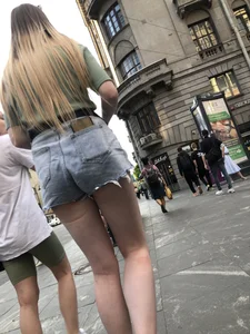 Street closeup of really hot legs and booty in fringed shorts