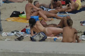 Topless girls on a beach in Barcelona