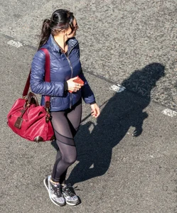 Brunette lady in leggings out walking