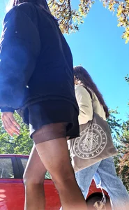 Teen wearing black pantyhose and a skirt, street sneaky photo