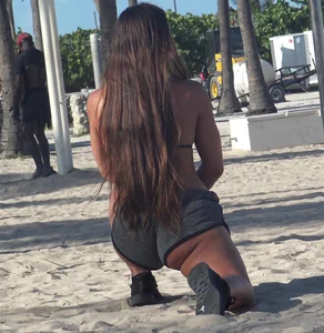 Hot candid athletic babe in little shorts stretching at the beach while showing off her ass (part 1)