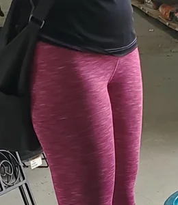 Milf shopping with a nice ass in tight maroon leggings
