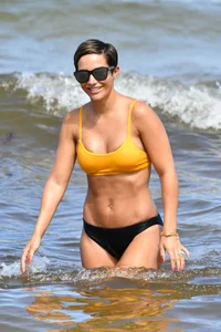Frankie Bridge nip slips in a bikini on the beach