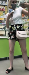 Blonde with Pale Skin in a Skirt and Sandals in the Pharmacy - Hot Legs Closeup