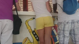 Milf in yellow shorts with vpl and a wedgie