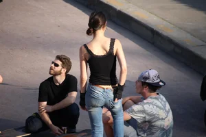 Hot brunette skateboarder in tight jeans and with hard nipples