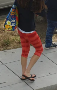Beautiful brunette teen in orange patterned leggings