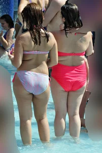 Two thick milfs at the pool in bikinis