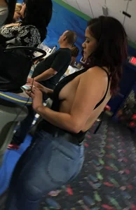 Thick brunette in tight jeans and showing some side boob