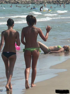 Bunch of sexy babes at the beach in thong bikinis