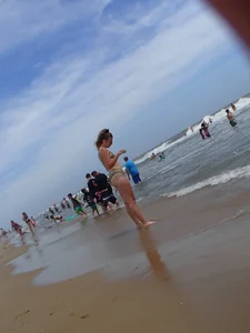 Big booty blonde on the beach in little green bikini