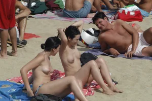 Topless girls on a beach in Barcelona