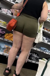 Juicy brunette in green spandex shorts OC
