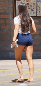 Hot brunette with a great ass in tight denim shorts
