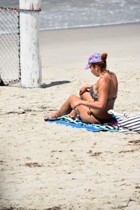 Redhead with nice tits in a bikini on the beach