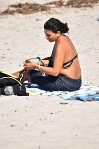 Thick mature brunette bikini lady on the beach with a nice body