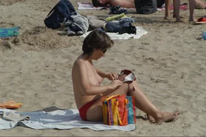 Girls on a nude beach in Sitges, Spain