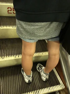 Girl in Boyish Clothes with Skinny Legs Subway Escalator Candid