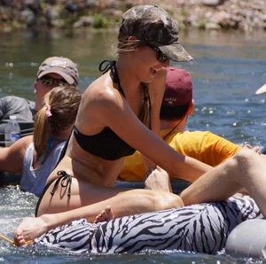 Sexy party girls in bikinis on a lake