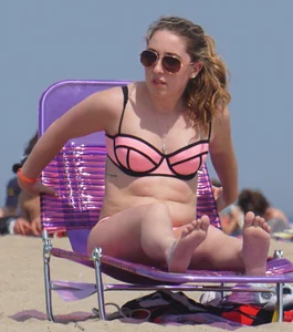 Cute babe in pink and black bikini with a bit of camel toe