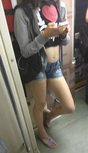 Teen in a Top, Mini-Shorts and Sandals in a Subway Train Candid