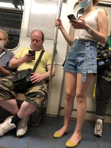 Girl in Blue Denim Shorts and Flats Standing in Subway Train - Nice Legs Closeup