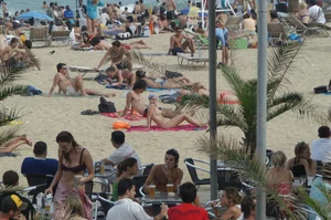 Topless girls on a beach in Barcelona
