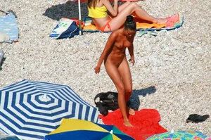 Ula FKK Sexy brunette on a nude beach topless, bottomless and with blue thong