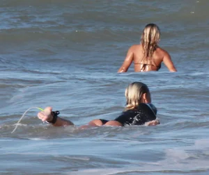 Hot surfer chicks out in the water
