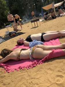 Hot Girls in Swimsuits Lying on a Beach Gallery