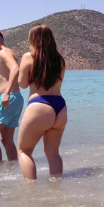 Thick lady at the beach in little blue bikini with big ass