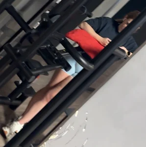 Hot blonde in gym just to show off her tight ass in blue shorts