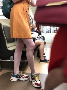Cute Teen Girl in a Dress With Slim Legs Standing in the Subway Train, Then Crossing the Street Photo Gallery