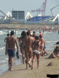 Bunch of sexy babes at the beach in thong bikinis