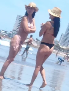 2 milfs in thong bikinis on the beach