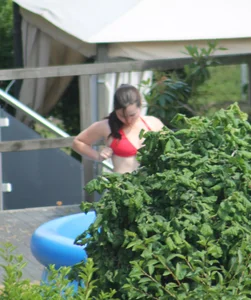 Thick babe in the backyard in red bikini