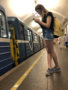 Cute Skinny Teen in Jean Mini Shorts Standing on the Subway Platform