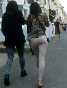 Brunette lady with a nice ass in light grey leggings walking