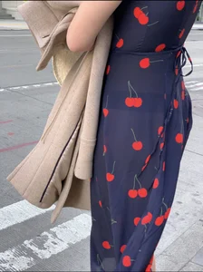 Business women with a visible thong in a see through Cherry Dress
