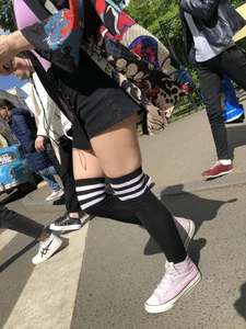 An Anime Fan Teen in a Short Skirt And Stockings Bending Over on the Crosswalk Street Creepshots