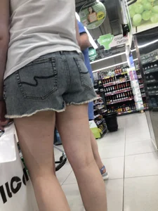 Awkward Candid Teen Girl in Jean Shorts And Sneakers at the Supermarket Creepshots Gallery