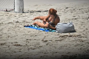 Redhead with nice tits in a bikini on the beach