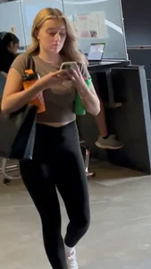 Blonde College Girl In Leggings Girl Keeps Touching Her Booty